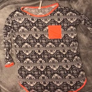 Black and white tunic with orange accents